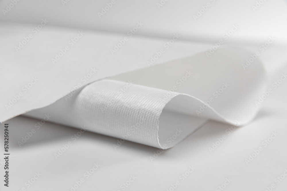 White wrapping paper of Tyvek, mock up, template, waterproof material. White wrapping paper of Tyvek, mock up, template, waterproof material.
