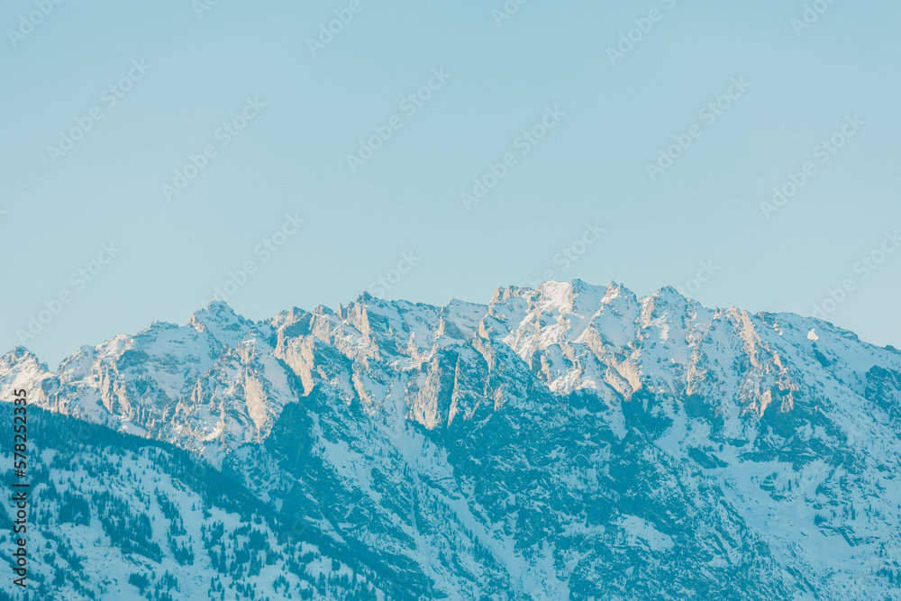 snowy ridges in the grand teton mountain range on a sunny day snowy ridges in the grand teton mountain range on a sunny day