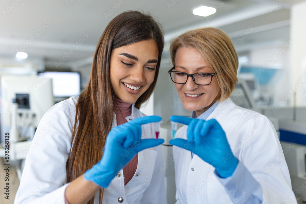 Scientist holding samples into tubes in research laboratory. Advanced Scientific Lab for Medicine, Biotechnology, Microbiology Development Scientist holding samples into tubes in research laboratory. Advanced Scientific Lab for Medicine, Biotechnology, Microbiology Development