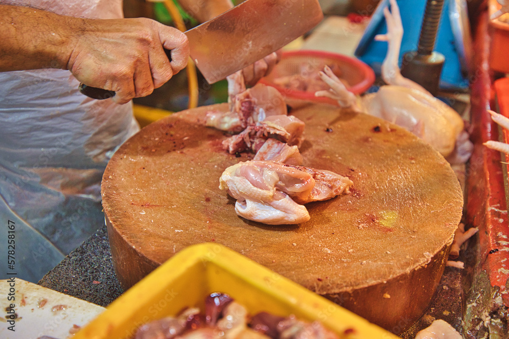 A snapshot of butchered meat in Kuala Lumpur's Chow Kit Road Market, the bustling heart of activity with butchery vendors touting their wares and shoppers elbowing each other for space.