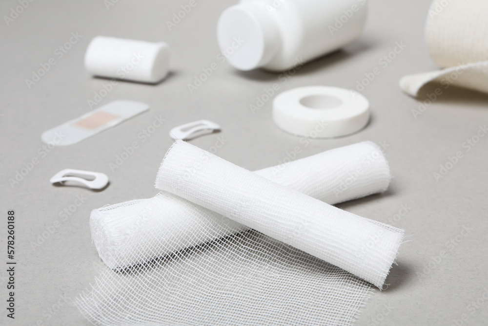 Obraz premium First aid kit supplies on gray background