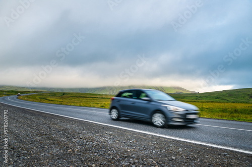 Car trip in Iceland, auto on the road, motion blur