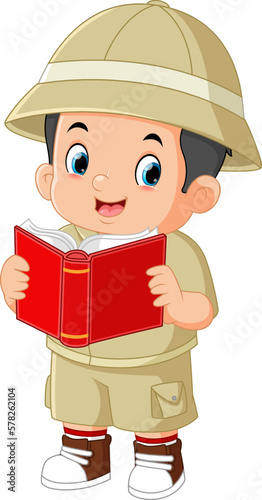 a cute adventurous boy is reading a book of folk legends