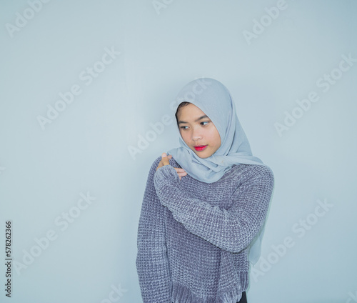 portrait of happy asian smiling wearing hijab isolated on light grey background. ramadan concept