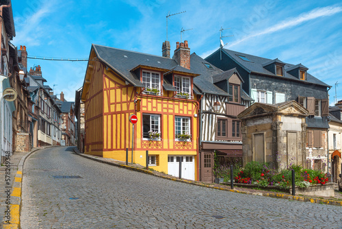 Old cozy street with timber framing houses in Honfleur, Normandy, France. Architecture and landmarks of Honfleur