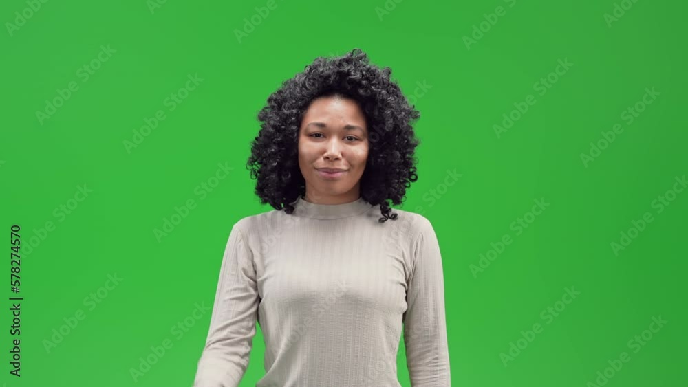 A girl on a green screen background is showing the loser sign with her hand. High quality 4k footage A girl on a green screen background is showing the loser sign with her hand. High quality 4k footage