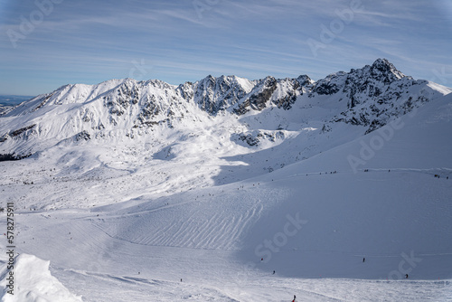 View of the Tatra Mountains in winter from the peak of Kasprowy Wierch. Sunny weather during a hike in the mountains.