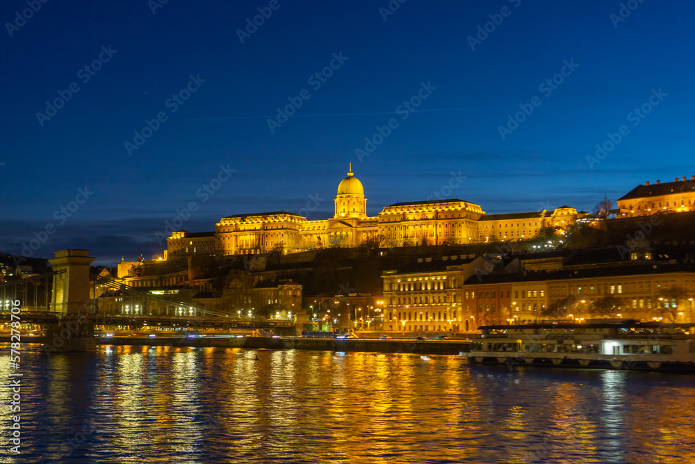 The Budapest Royal Palace at night, with the Danube in the foreground