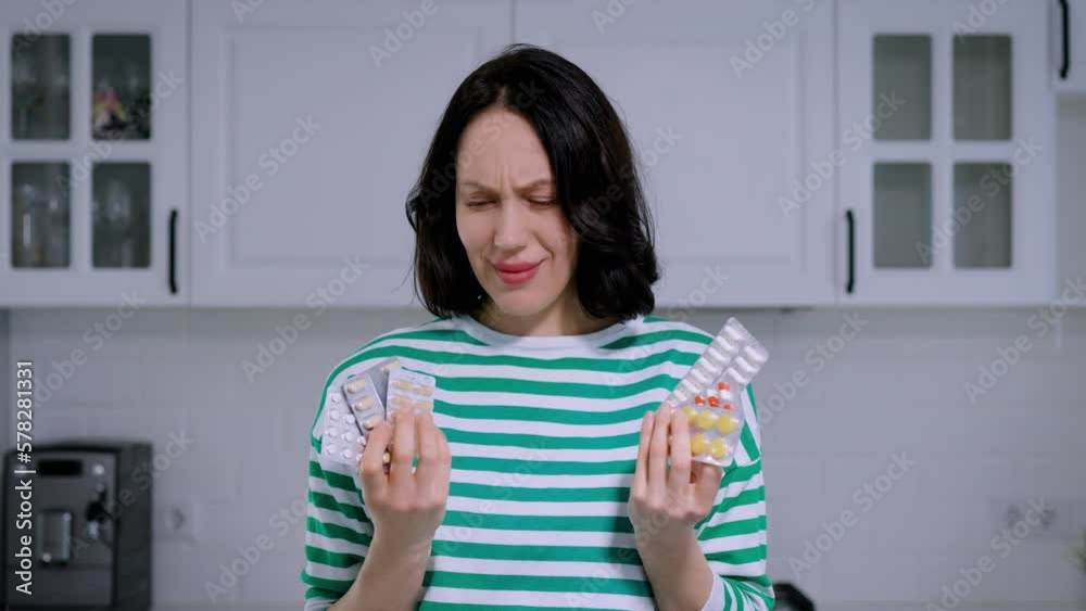 Woman does not want to take pills, refusal of medication. Lots of pills vitamins Woman does not want to take pills, refusal of medication. Lots of pills vitamins