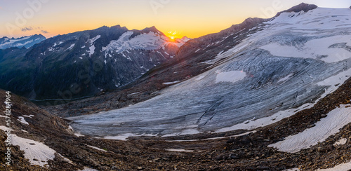 A setting sun above the Inneres Mullwitzkees glacier in High Tauern national park in Austria.