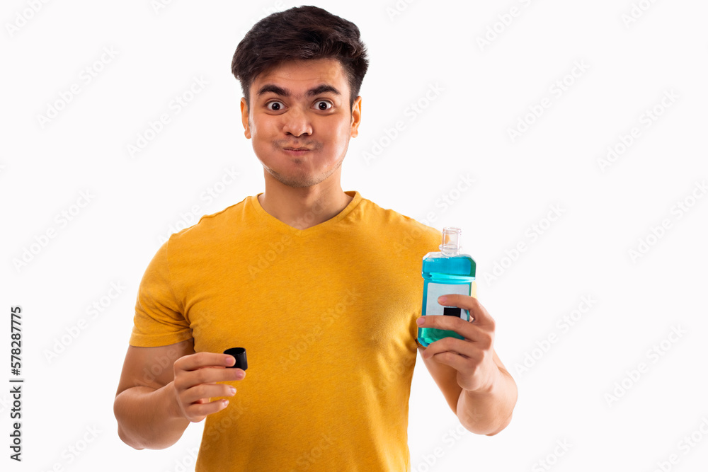 Young man rinsing mouth with mouthwash Young man rinsing mouth with mouthwash