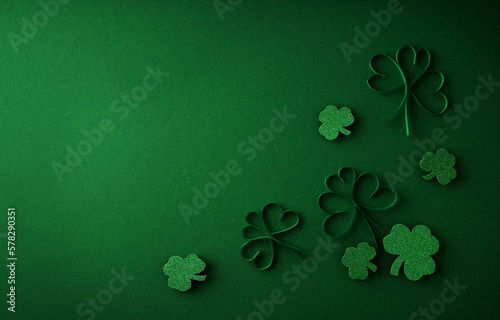 Saint Patrick day flat lay concept with shamrock clover on green background