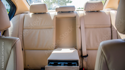 Rear passenger beige car seats with armrests © Vladimir Bartel