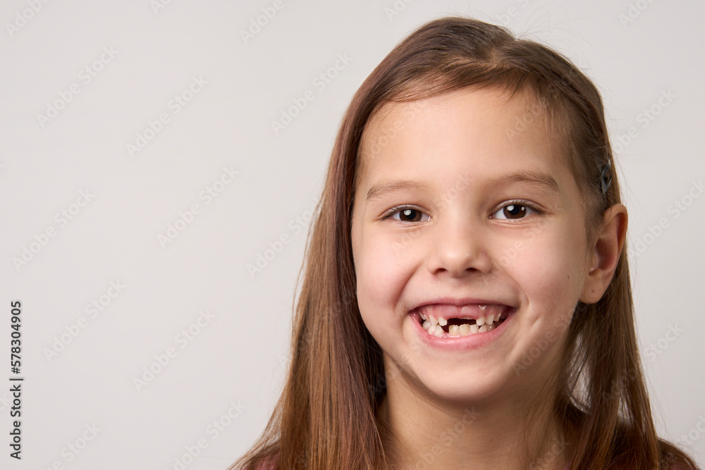 Happy smiling child girl on white background with copy space Happy smiling child girl on white background with copy space
