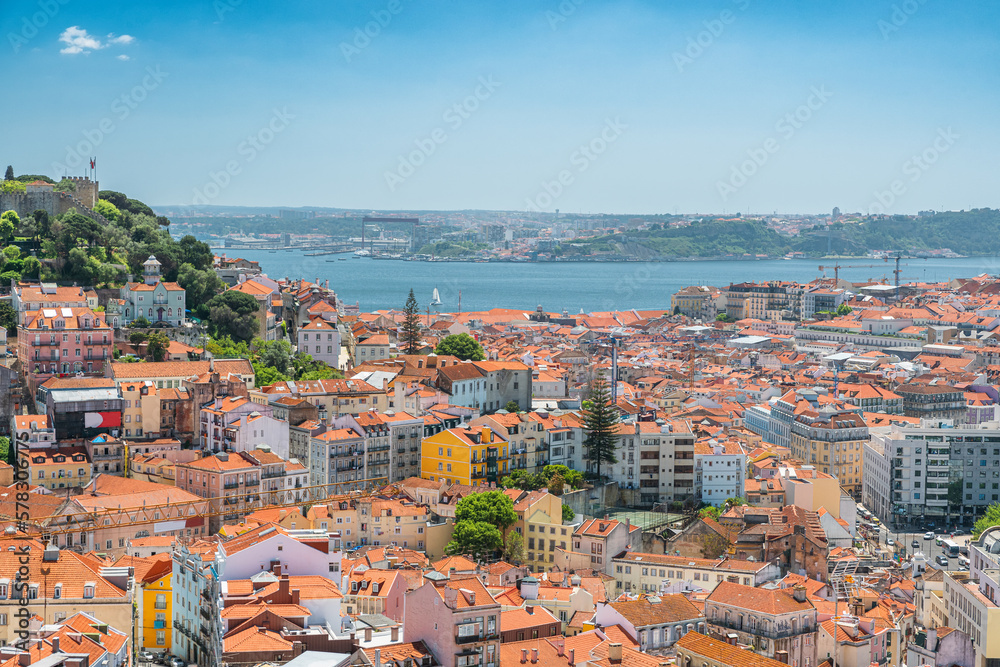 Aerial view of Lisbon old town on Tagus river with medieval buildings and castle. Lisboa, Portugal skyline