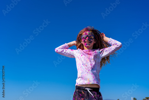 Young european girl celebrating holy festival on a blue sky background