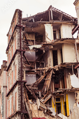 Degraded and crumbling building structure with wooden foundations