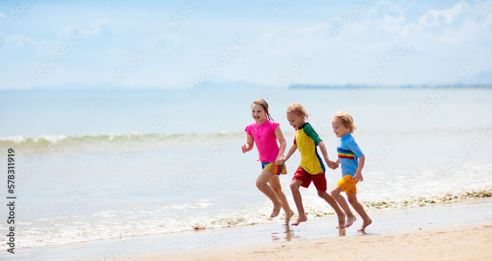 Kids playing on beach. Children play at sea. Kids playing on beach. Children play at sea.