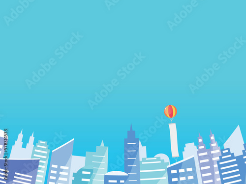 高層ビルの背景　横位置　青空とアドバルーン