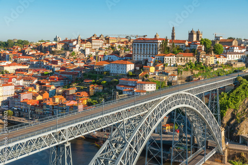 Dom Luis bridge in Porto, Portugal. Old town skyline from Gaia city on Douro river with colorful buildings and bridge