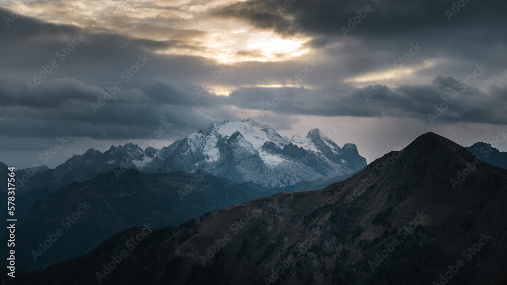 Sunset in the ranges and snow capped mountains of Dolomites, Italy