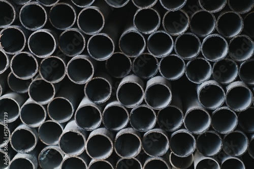 Stack of rolled metal products  perspective view of steel pipes of rectangular cross-section