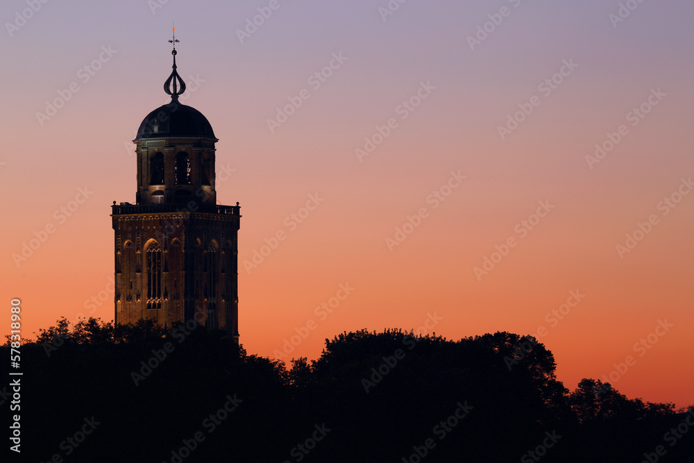 The tower of the Great Church in Deventer, the Netherlands, just before sunrise. Check out the contrast between the colorful sky and the subtle lit churchtower.
