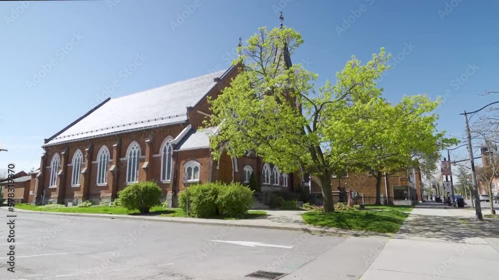 A Milton Church with trees in front on a sunny summer day. A Milton Church with trees in front on a sunny summer day.