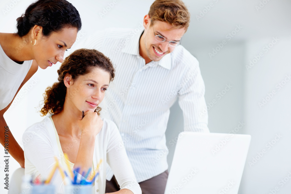 Executives using laptop. Three business colleagues working on laptop. Executives using laptop. Three business colleagues working on laptop.