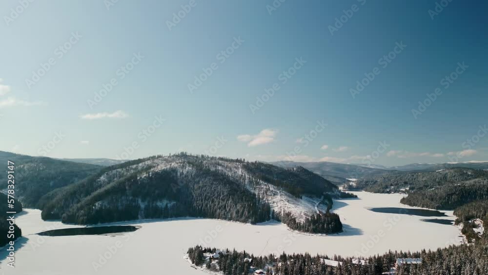 Aerial View of Frozen Lake and Snowy Forests in Romania on a Beautiful Cold Day, Drone Shot with Panoramic View, 4K Aerial View of Frozen Lake and Snowy Forests in Romania on a Beautiful Cold Day, Drone Shot with Panoramic View, 4K