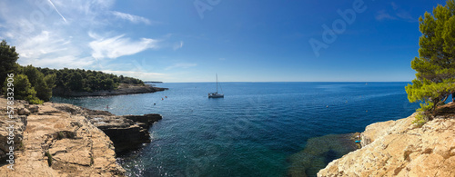 Panorama View of Sunny Rocky Beach in Pula. Beautiful Summer Scenery in Croatia. European Rocky Shore with Adriatic Sea. 