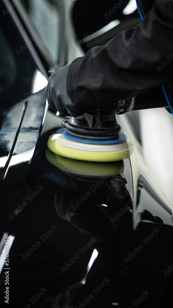 Car paint polishing in a car detailing studio or car wash Stock Photo