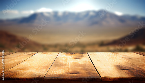Empty wood table top with the mountain landscape. The blurred landscape of mountains background. Top view serenity. For montage product display layout.
