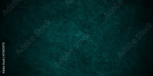 Dark green background with grunge backdrop texture, watercolor painted mottled green background, colorful bright ink and watercolor textures on black grunge wall paper background.