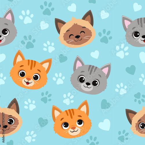 Seamless pattern with cats.Cute cartoon kittens on blue background.Vector illustration