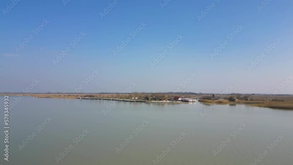 Aerial view of the shore of Neusiedl Lake, lakeside pools and ferry service, 4k Aerial view of the shore of Neusiedl Lake, lakeside pools and ferry service, 4k