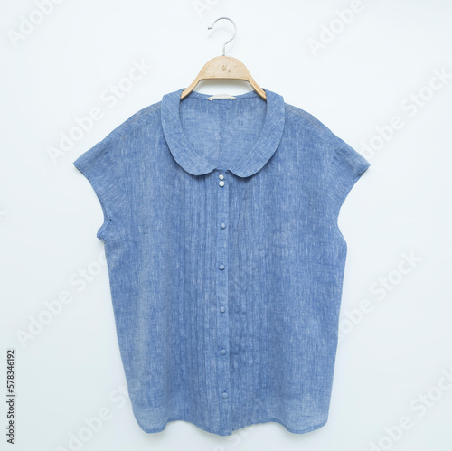  Woman blouse with blue blouse cotton on white background. © Pornpawit