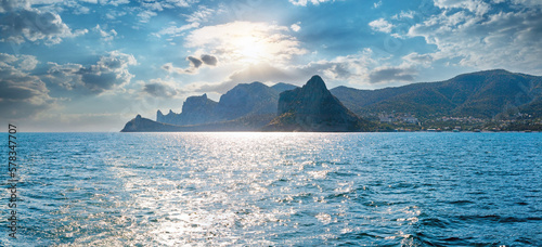 Scintillate sea surface and summer rocky coastline, Crimea, Ukraine.
