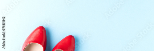 Overhead shot of red high heels on blue background