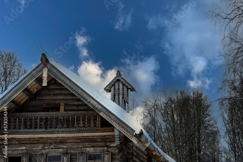 old houses and household buildings made of wooden beams according to old technologies in the vicinity of Veliky Novgorod in winter