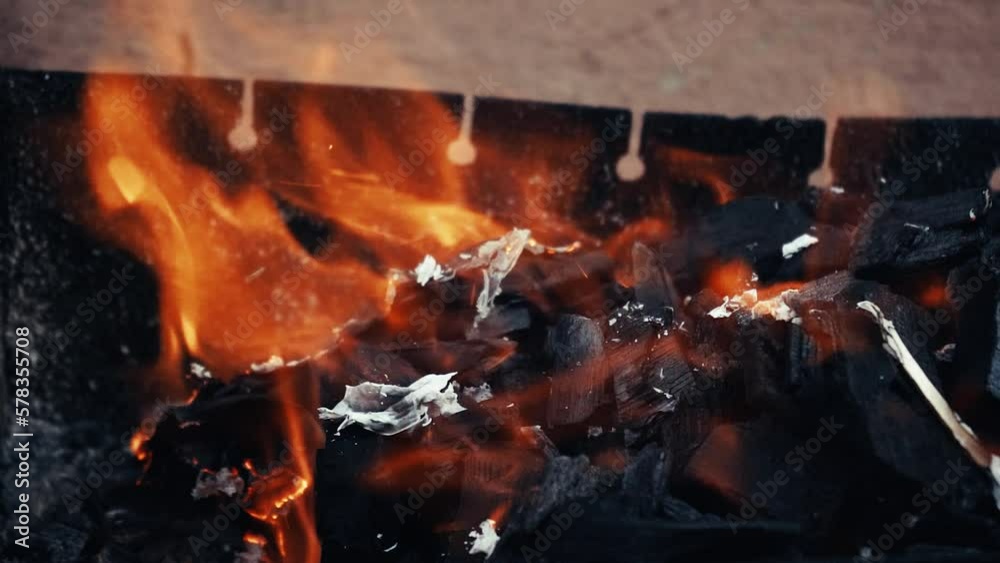 Close-up of a warm cozy burning fire in a metal brazier. Slow motion. HD video format. Close-up of a warm cozy burning fire in a metal brazier. Slow motion. HD video format.