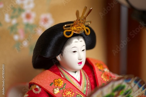 A Japanese hina doll in red kimono photo