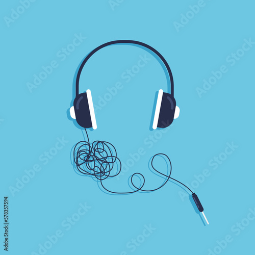 Tangled wires headphone. Vector illustration in trendy flat style isolated on blue background.