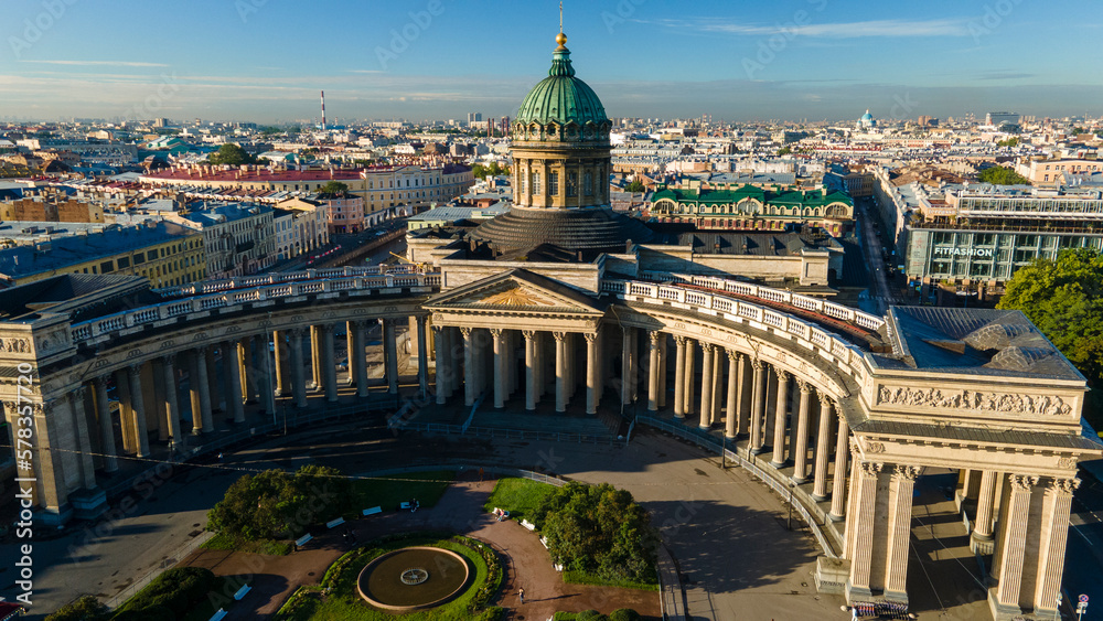 Fototapeta premium Aerial view of the Kazan Cathedral and the river in the historical and at the same time modern city of St. Petersburg at sunny summer dawn 