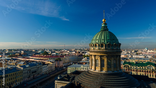 Aerial close view of the Kazan Cathedral in the historical and at the same time modern city of St. Petersburg at sunny summer day sunrise 