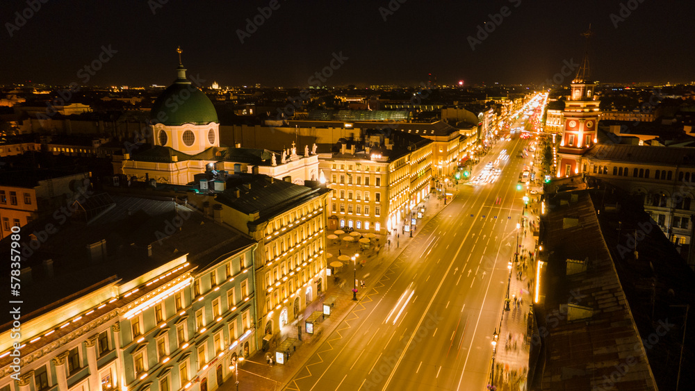 Aerial view of the Nevski street and Kazan Cathedral next to House of the Singer company in the historical and at same time modern city of St. Petersburg at  night
