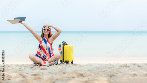 Lifestyle freelance woman raise arms relax after using laptop working on the beach.  Asian people success and together your work pastime and meeting conference on internet in holiday