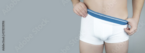 Quadro em tela Close-up of a man in white underwear
