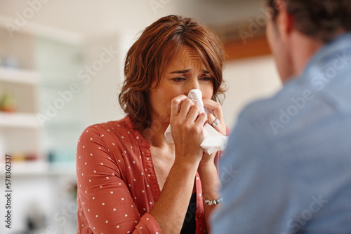 Shes reached her breaking point. a woman crying in front of her husband.