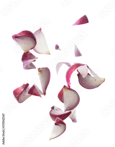 Shallots fall fly in mid air, red fresh vegetable spice shallots onion floating. Organic fresh herbal shallots root head cut chop slice. White background isolated freeze motion high speed shutter photo